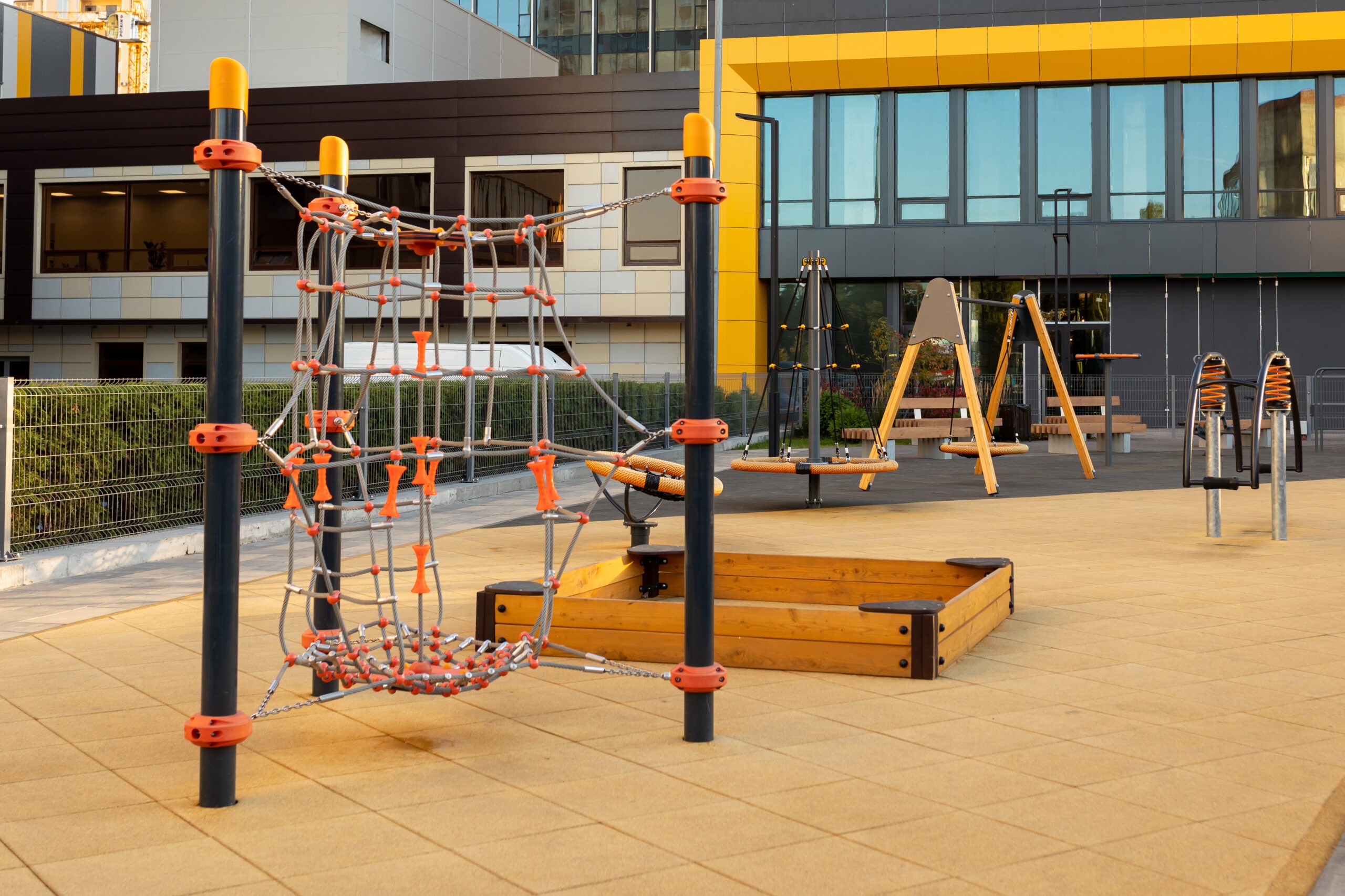 Modern children’s playground near in a modern urban residential area. Without children. school start-up and management services
