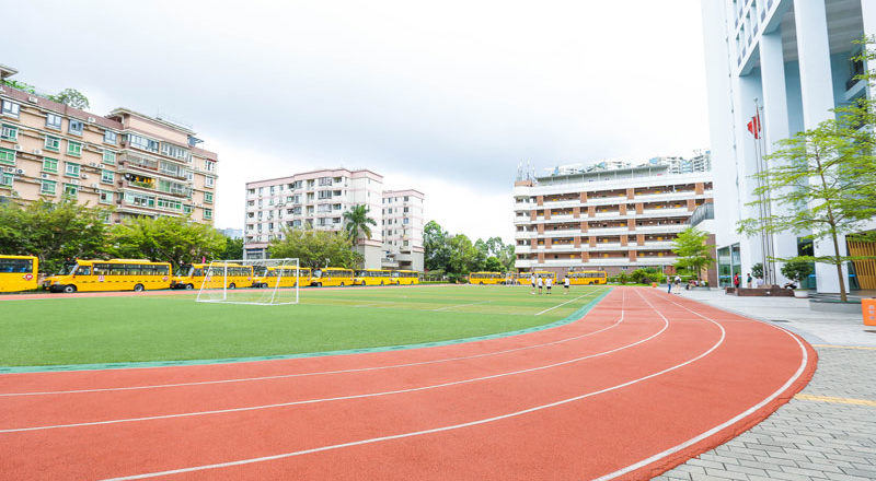 ISS school campus with track and buses